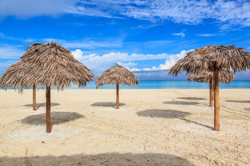 Beach in the Caribbean and umbrellas.