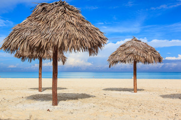 Beach in the Caribbean and umbrellas.