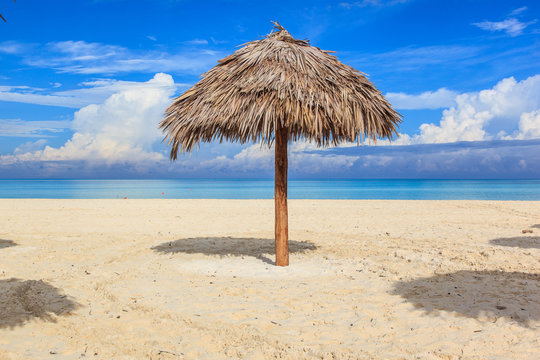 Beach in the Caribbean and umbrellas.