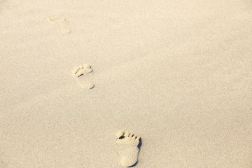 Human footprints on the beach sand

