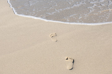 Human footprints on the beach sand
