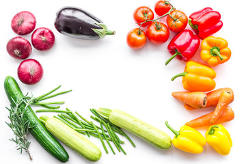 Colorful vegetables for healthy diet. Paprika, tomatoes, carrot, zucchini, eggplant on white background top view copyspace