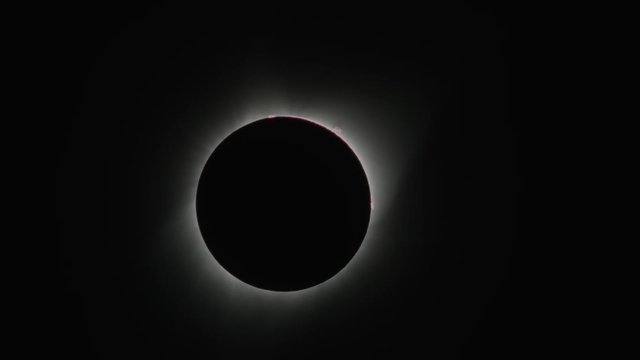 Total solar eclipse changing to reveal lens flare / Driggs, Idaho, United States