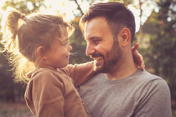 Father and daughter share love.