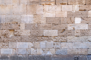 Yellow castle rugh pattern stone block from ancient structure texture