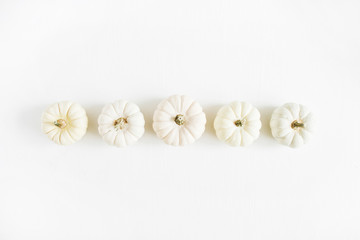 White pumpkins. Fall autumn minimal concept. Flat lay, top view.