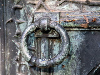Closeup of a old metal door knocker.
