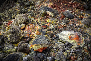 Colorful lava rocks near the summit crater on mount Etna, Sicily, Italy.