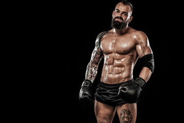 Obraz na płótnie Canvas Bodybuilder posing. Beautiful sporty guy male power. Fitness muscled man. Spot concept