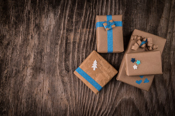 Vintage gift boxes with bow on wooden background and copy space