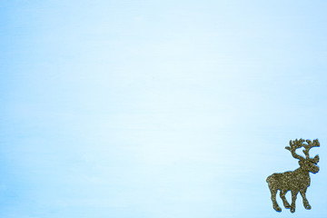 Christmas decoration, decorative reindeer on a blue background,Copy space.