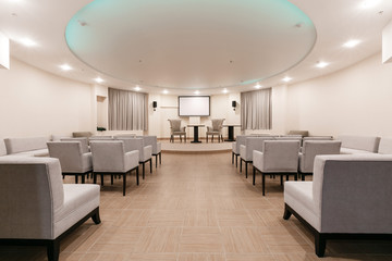 Row of chairs in boardroom. seats in an empty conference room