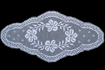 Beauty white oval lace tablecloth isolated on black background, floral pattern