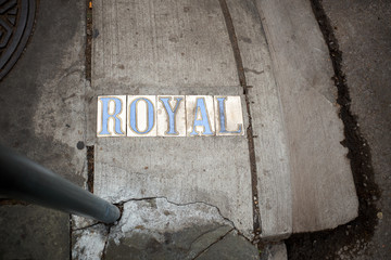 Inset sign for Royal in a cement sidewalk
