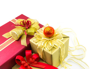 Christmas new year celebration decorations concept - Red and gold gifts box and decorating elements on white background.