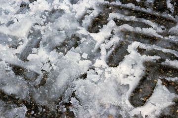 the tire tracks of the grader in the snow