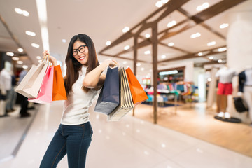 Blurred, defocused background of men's clothing shops in modern department store