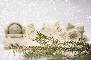 Fototapeta na wymiar soap Handmade on a brilliant Christmas background