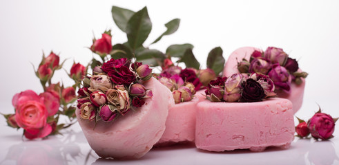 soap handmade with roses on a white background