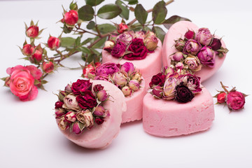 soap handmade with roses on a white background