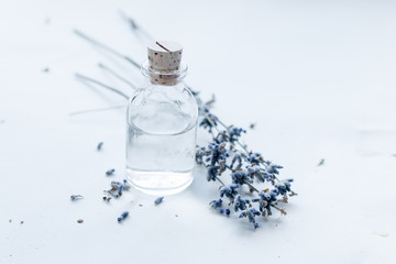 Little glass bottle with liquid and lavender