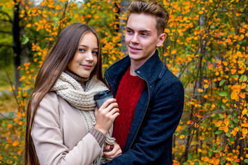 Couple walking in an autumn park