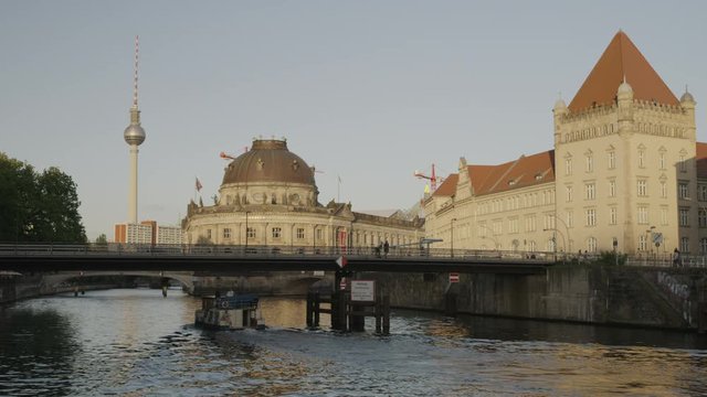 Wide slow motion shot of urban bridge over river / Berlin, Germany
