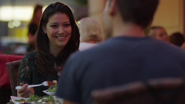Close up of couple eating at restaurant / Berlin, Germany