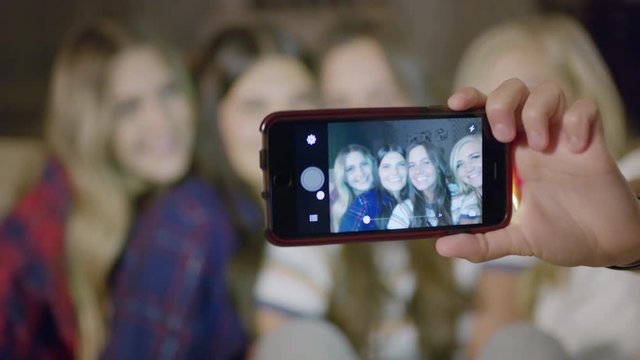 Close up of girls posing for cell phone selfie / Cedar Hills, Utah, United States