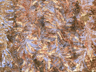 A lot of Christmas tinsel. Color festive Christmas background.
