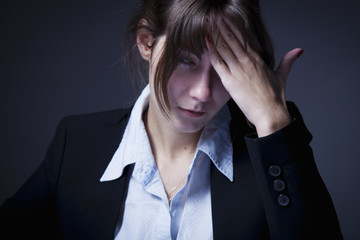 Stress for professional burnout. Portrait of exhausted and tired business woman in the office (Depression, sadness, problems, difficulties concept)