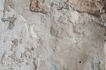 old chipped plaster on the concrete wall, abstract concrete, grey texture, background