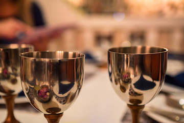 Close up shiny metal glasses for wine