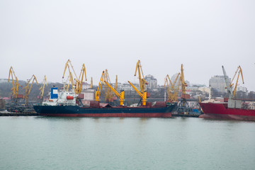 Vessel dry cargo on loading, unloading in port. Bulker in port. port terminal