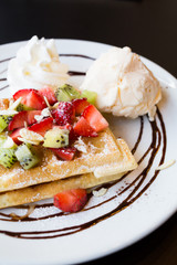 Waffles with fresh berries, whipped cream and ice cream