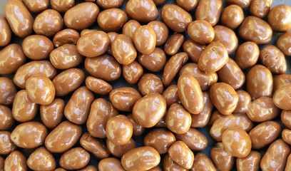 Peanuts in chocolate background