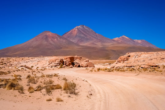 Sandy and gravel desert road through southern Altiplano