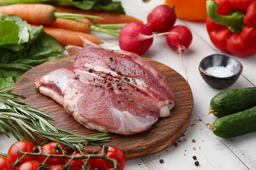 Raw duck fillet steak and fresh vegetables