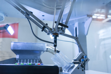 robot with vacuum suckers with conveyor in manufacture phone factory,Smart factory industry 4.0 concept.