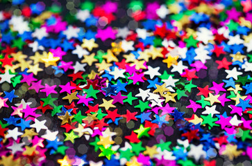 Multicolored holiday stars decoration background