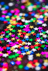 Multicolored holiday stars decoration background