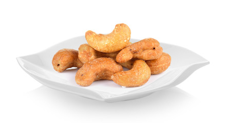 cashew nut in ceramic plate (beautiful shape) on white background