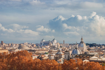 Fototapeta na wymiar Rome autumn panorama with yellow leaves and clouds