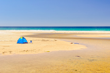 Beach tent at the mouth of the Little Beach Creek in Chain of Lagoons on the East Coast of Tasmania, Australia