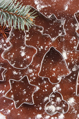 Dough for Christmas cookies and cookie cutters, concept of baking gingerbread