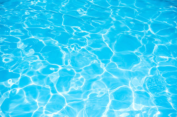 Fototapeta na wymiar Beautiful ripple wave and blue water surface in swimming pool, Blue water for background and abstract