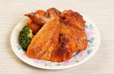 Grilled chicken wings served on a plate    