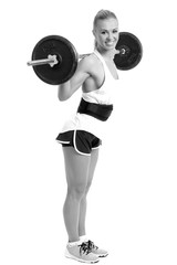 Obraz premium athletic girl with a barbell on a white background