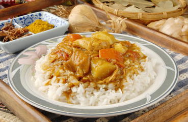 Chicken curry over steamed white rice.