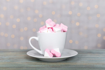 white cup with pink heart marshmallow